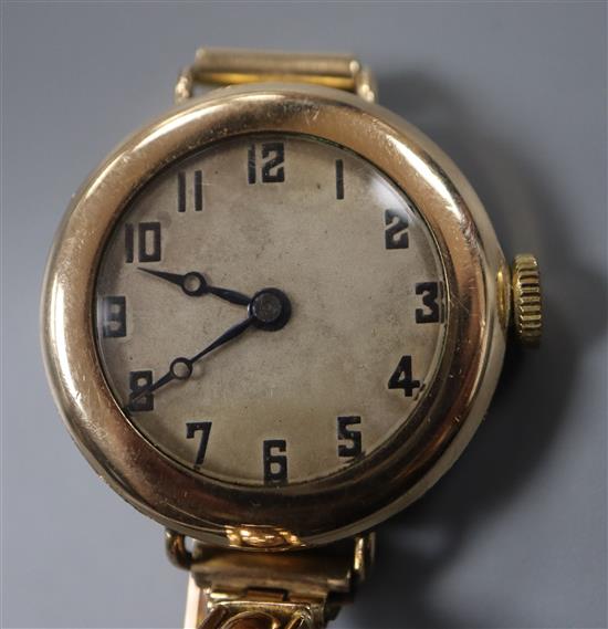 An early 20th century gold plated manual wind watch, the movement signed Rolex, on a 9ct expanding bracelet.